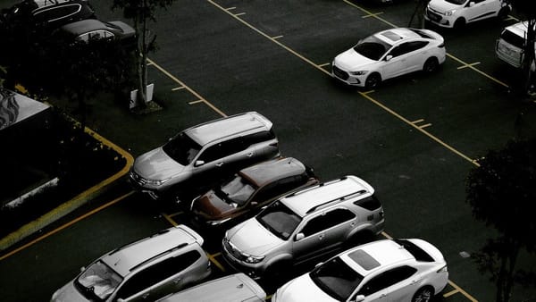 cars in a parking lot, seen from a high window