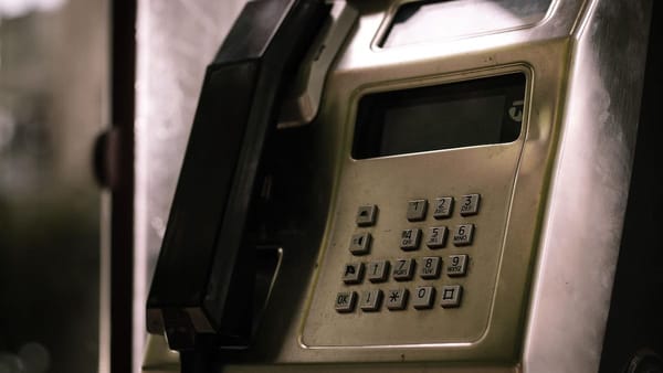 Old style pay phone with push buttons