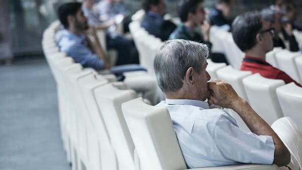 seated adult audience at a lecture