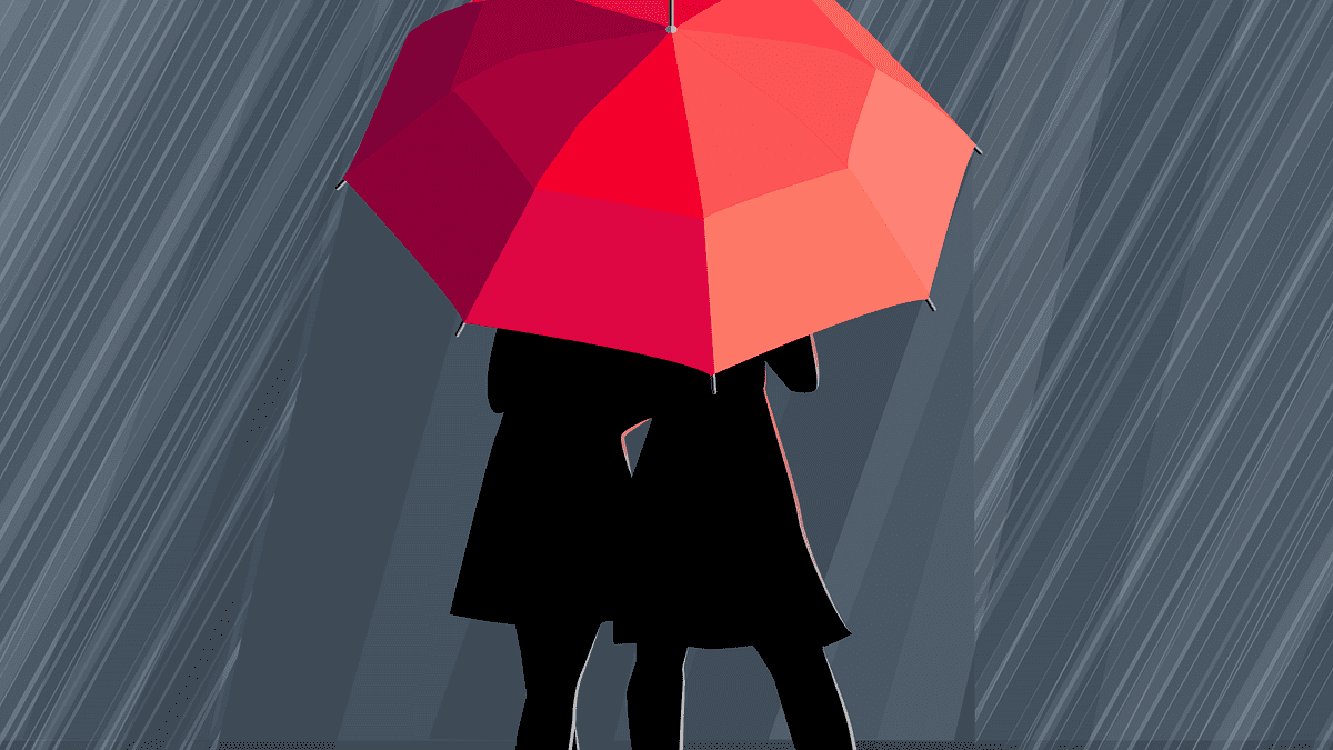 two silhouettes standing under a red umbrella