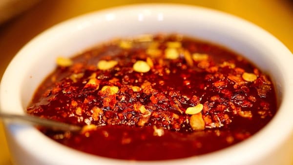 bowl of red chili with corn