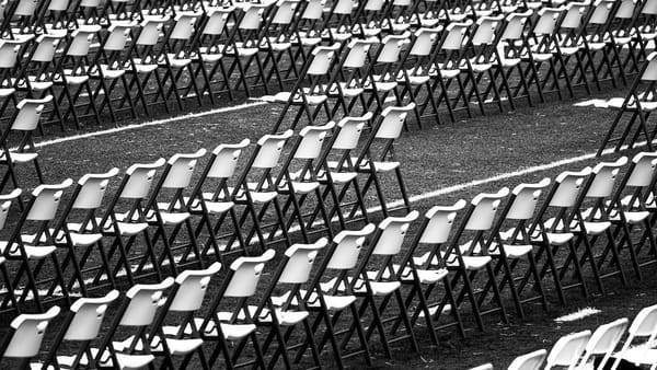 rows of folding chairs in a large room